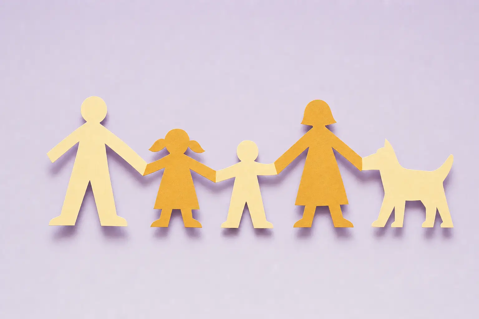 A paper chain of cut-out dolls with two tall figures, two small figures and a dog shape on a lavender background